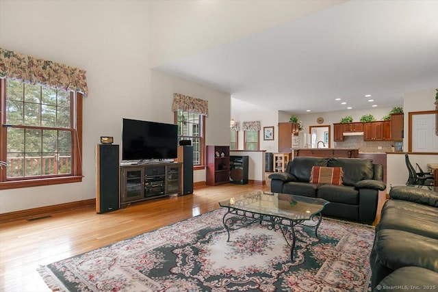 92 Tyler City Rd, Orange, CT 06477 - living area featuring plenty of natural light, light wood-style floors, and recessed lighting