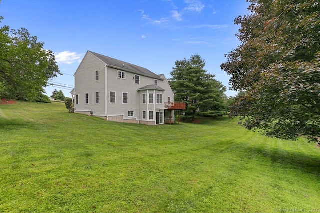 92 Tyler City Rd, Orange, CT 06477 - rear view of property featuring a lawn and a wooden deck
