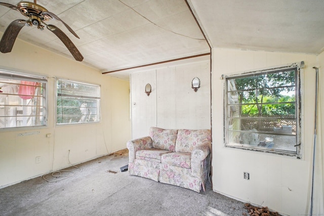 46 Harrington Dr, Plainfield, CT 06374 - living area featuring lofted ceiling, carpet flooring, healthy amount of natural light, a ceiling fan, and wooden walls