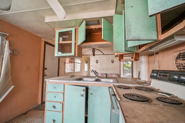 46 Harrington Dr, Plainfield, CT 06374 - kitchen with range with electric cooktop, light countertops, and glass insert cabinets