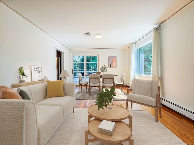 7 Ambler Rd W, Westport, CT 06880 - living area featuring light wood-style flooring, healthy amount of natural light, and baseboard heating