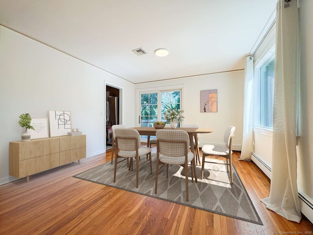 7 Ambler Rd W, Westport, CT 06880 - dining area featuring light wood-style floors and a baseboard heating unit