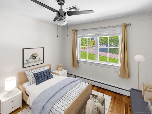 7 Ambler Rd W, Westport, CT 06880 - bedroom with a baseboard radiator, wood finished floors, and ceiling fan