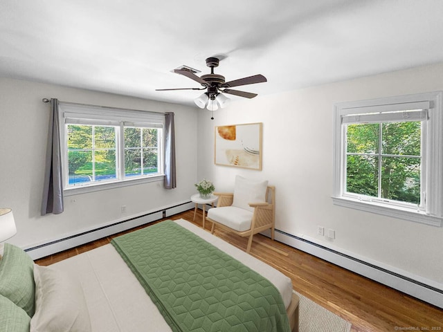 7 Ambler Rd W, Westport, CT 06880 - bedroom with a baseboard radiator, wood finished floors, and a ceiling fan
