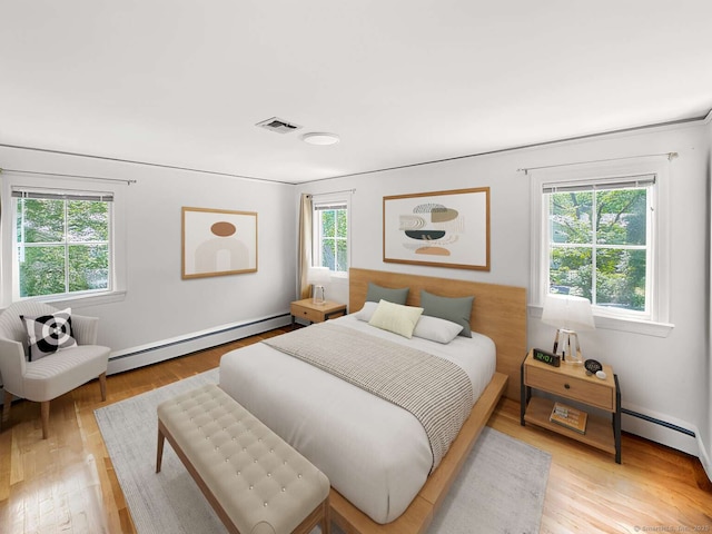 7 Ambler Rd W, Westport, CT 06880 - bedroom with baseboard heating and light wood-style flooring
