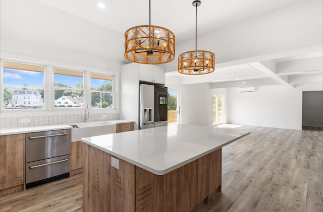 281 E Ave, Norwalk, CT 06850 - kitchen featuring refrigerator with ice dispenser, modern cabinets, a chandelier, light countertops, and beam ceiling