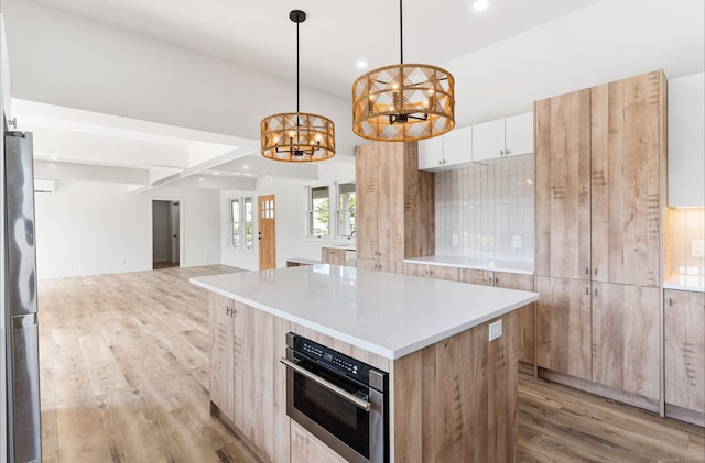 281 E Ave, Norwalk, CT 06850 - kitchen with freestanding refrigerator, recessed lighting, a chandelier, light wood-type flooring, and modern cabinets