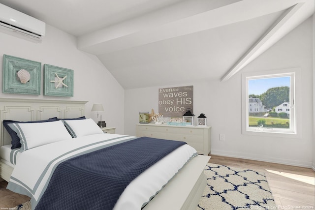 281 E Ave, Norwalk, CT 06850 - bedroom with a wall mounted air conditioner, vaulted ceiling, and light wood-style floors