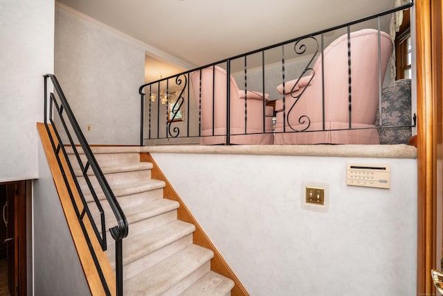 102 Herbert Dr, East Hartford, CT 06118 - staircase featuring crown molding and baseboards
