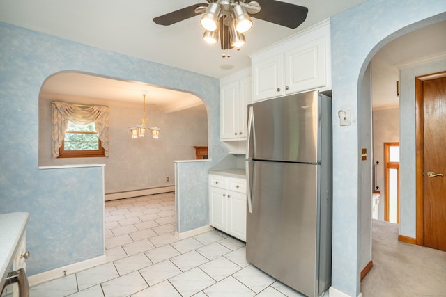 102 Herbert Dr, East Hartford, CT 06118 - kitchen featuring freestanding refrigerator, a baseboard radiator, a ceiling fan, and arched walkways