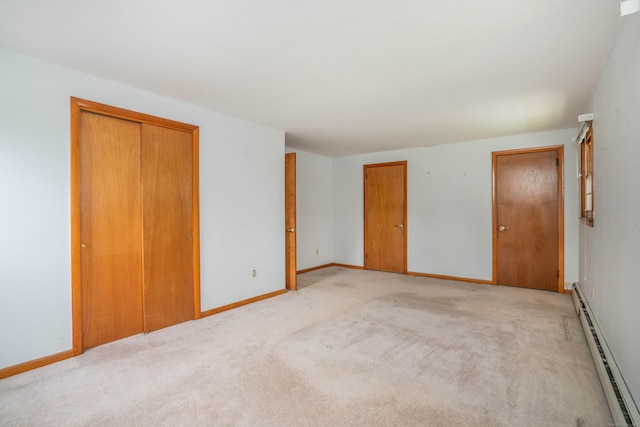 102 Herbert Dr, East Hartford, CT 06118 - unfurnished bedroom featuring a baseboard radiator and light colored carpet