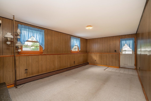 102 Herbert Dr, East Hartford, CT 06118 - foyer entrance featuring baseboard heating, carpet floors, and wood walls