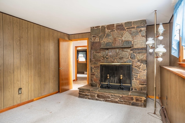 102 Herbert Dr, East Hartford, CT 06118 - unfurnished living room featuring carpet, wood walls, a baseboard heating unit, and a fireplace