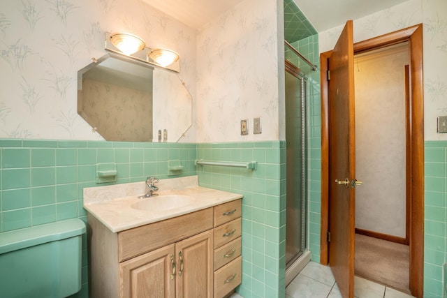 102 Herbert Dr, East Hartford, CT 06118 - full bathroom with wallpapered walls, vanity, tile walls, a stall shower, and wainscoting
