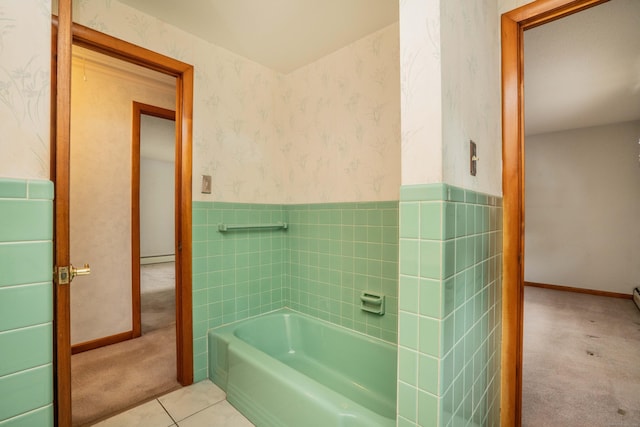 102 Herbert Dr, East Hartford, CT 06118 - bathroom featuring a garden tub, a wainscoted wall, wallpapered walls, tile patterned flooring, and tile walls