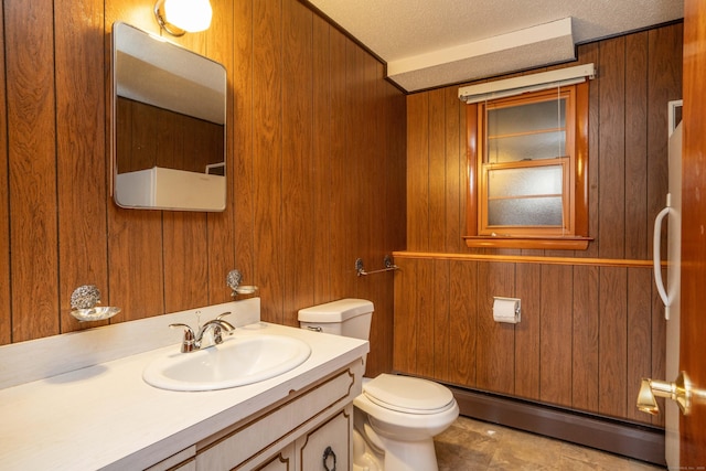 102 Herbert Dr, East Hartford, CT 06118 - bathroom featuring baseboard heating, wood walls, vanity, and a textured ceiling