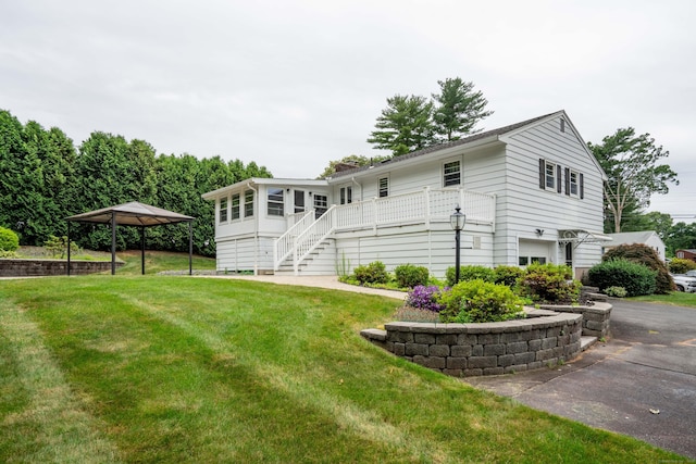 102 Herbert Dr, East Hartford, CT 06118 - view of home's exterior with stairway, a gazebo, a lawn, and a wooden deck
