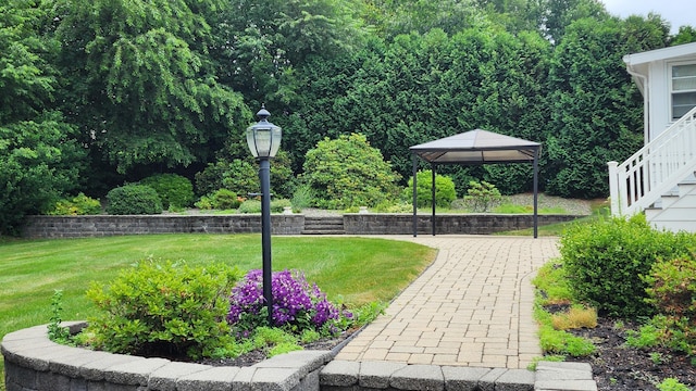 102 Herbert Dr, East Hartford, CT 06118 - view of grassy yard with a gazebo and stairway