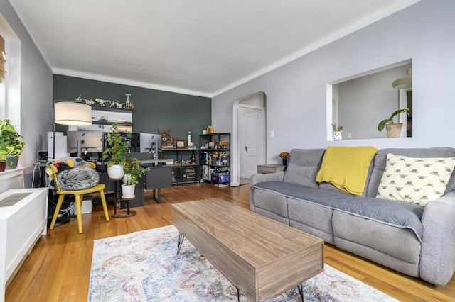 132 Summer St Unit 3C, Stamford, CT 06614 - living area featuring arched walkways, wood finished floors, and ornamental molding