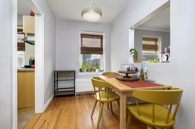 132 Summer St Unit 3C, Stamford, CT 06614 - dining area featuring light wood-style flooring and crown molding
