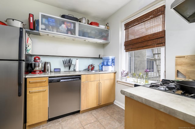 132 Summer St Unit 3C, Stamford, CT 06614 - kitchen featuring stainless steel appliances, light countertops, and glass insert cabinets