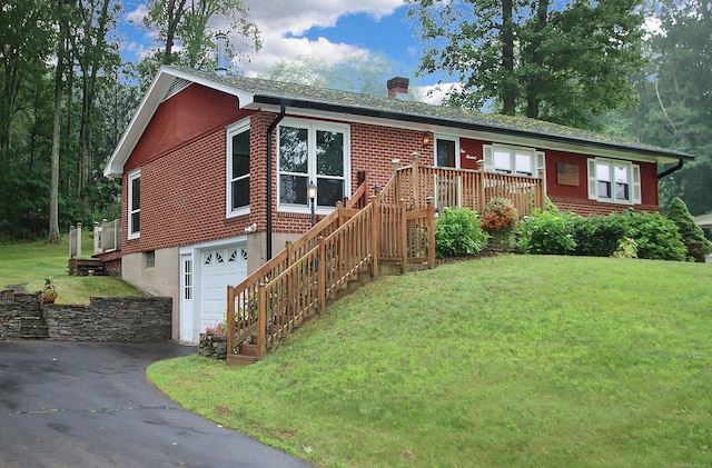 109 Pinnacle Rd, Ellington, CT 06029 - single story home with a chimney, a garage, asphalt driveway, and a front lawn