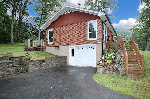 109 Pinnacle Rd, Ellington, CT 06029 - view of property exterior featuring stairway, driveway, an attached garage, a wooden deck, and brick siding
