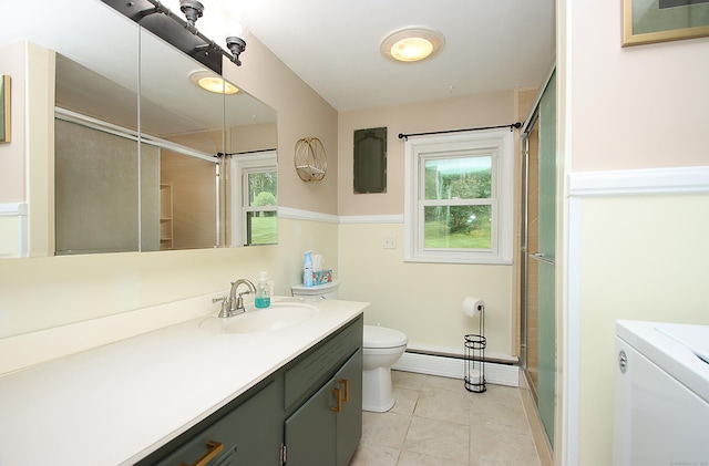 109 Pinnacle Rd, Ellington, CT 06029 - bathroom featuring washer / clothes dryer, tile patterned flooring, vanity, a shower with door, and a baseboard radiator