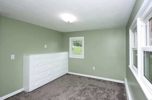 109 Pinnacle Rd, Ellington, CT 06029 - unfurnished bedroom featuring dark colored carpet and baseboard heating