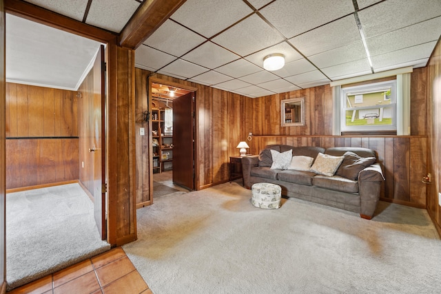 95 Flagg Ave, Watertown, CT 06779 - tiled living area featuring wood walls and carpet floors