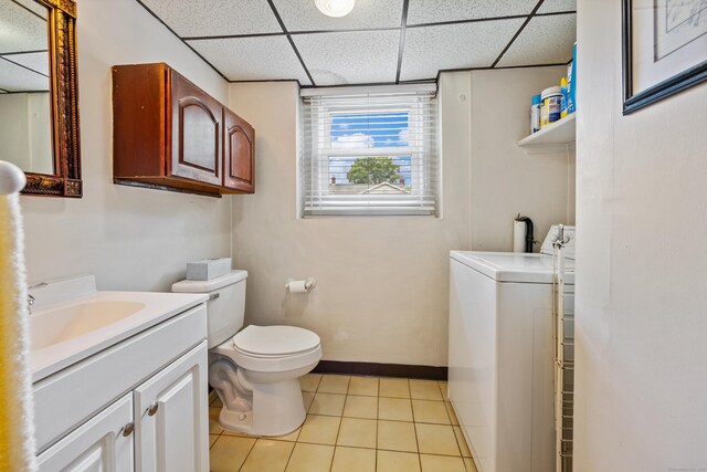 95 Flagg Ave, Watertown, CT 06779 - bathroom featuring washer / clothes dryer, vanity, tile patterned floors, and a paneled ceiling