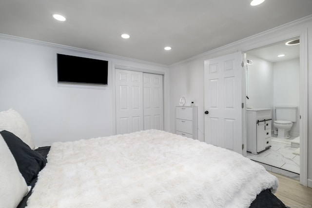 207 Hillcrest Rd, Bridgeport, CT 06606 - bedroom featuring recessed lighting, crown molding, connected bathroom, a closet, and light marble finish flooring