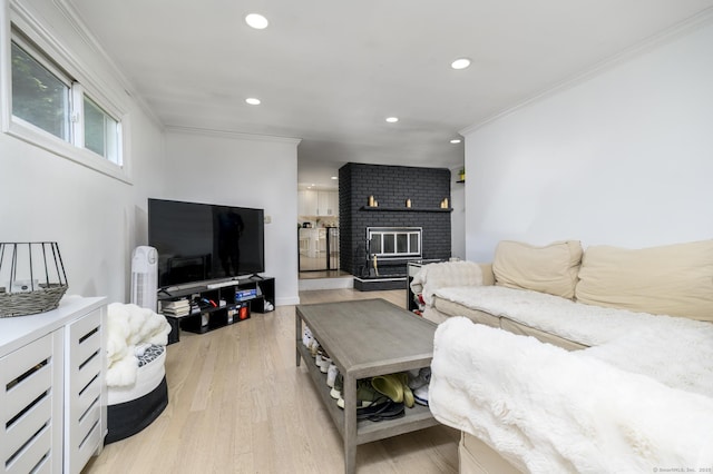 207 Hillcrest Rd, Bridgeport, CT 06606 - living area with ornamental molding, a brick fireplace, recessed lighting, and light wood-style floors