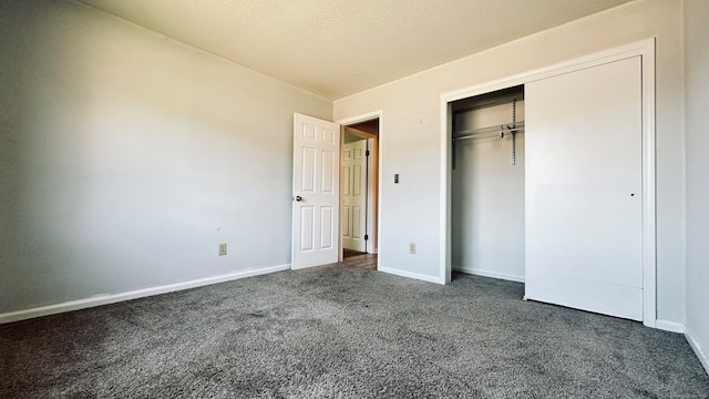 55 Thompson St Unit 17H, East Haven, CT 06513 - unfurnished bedroom featuring dark colored carpet and a closet