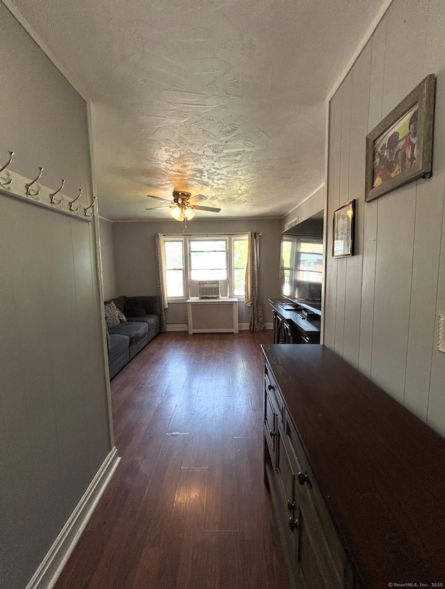 744 Canaan Rd Unit 23, Bridgeport, CT 06610 - kitchen with dark wood-style flooring, a ceiling fan, dark countertops, a textured ceiling, and radiator heating unit