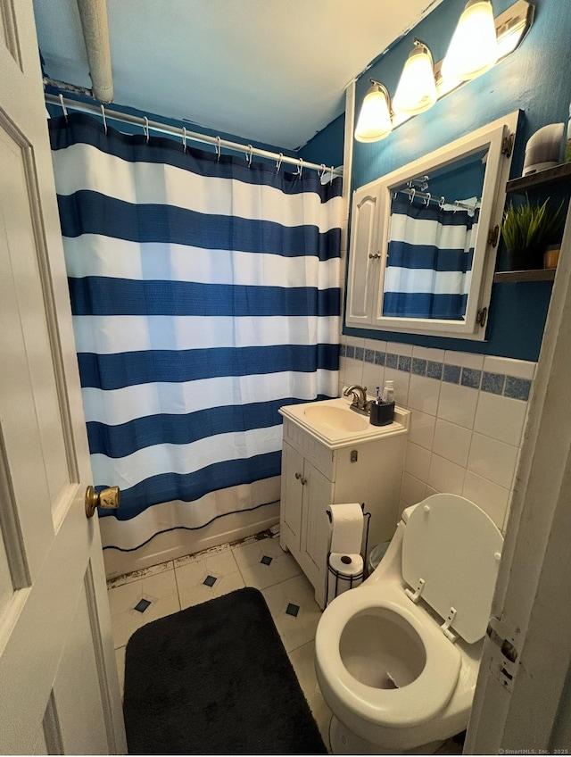 744 Canaan Rd Unit 23, Bridgeport, CT 06610 - full bathroom featuring tile patterned floors, vanity, tile walls, and a shower with shower curtain