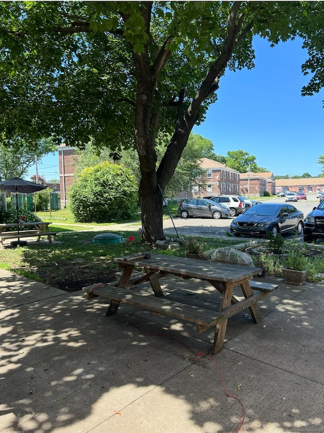 744 Canaan Rd Unit 23, Bridgeport, CT 06610 - view of home's community with uncovered parking and a patio