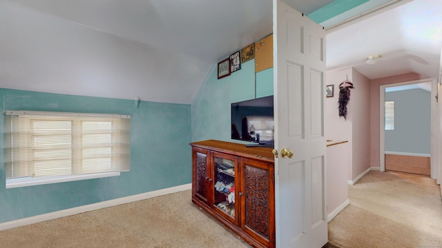 96 Davis Ave, Bridgeport, CT 06605 - carpeted living area with lofted ceiling and baseboards