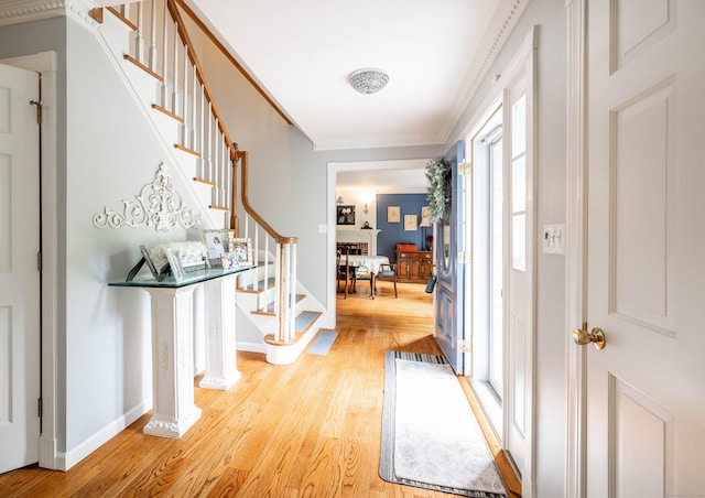 51 Wood Lot Ln, Southbury, CT 06488 - entryway featuring stairway, light wood-style floors, and crown molding