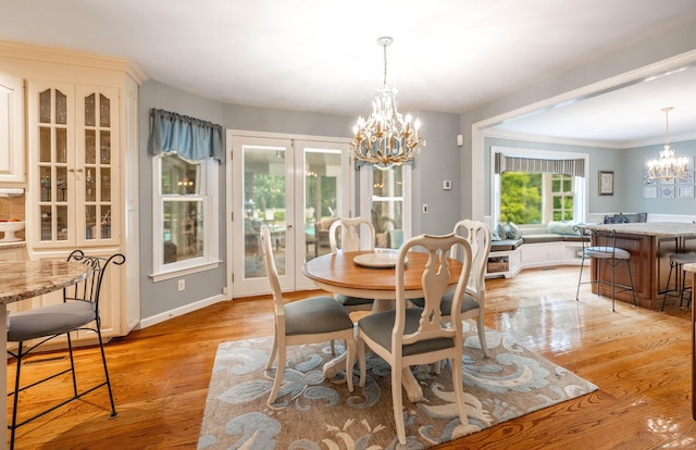 51 Wood Lot Ln, Southbury, CT 06488 - dining room with a chandelier, light wood-type flooring, and ornamental molding