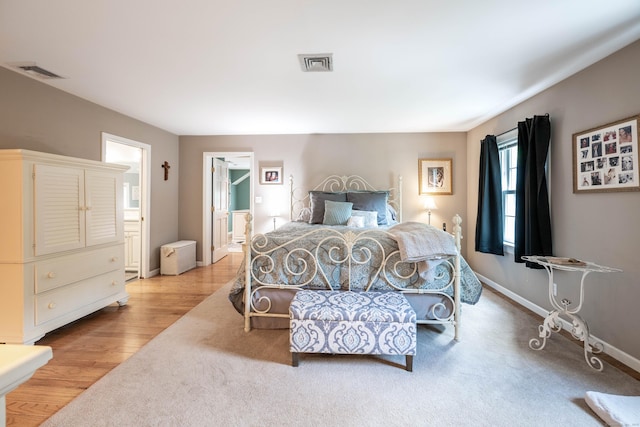 51 Wood Lot Ln, Southbury, CT 06488 - bedroom featuring ensuite bath and wood finished floors