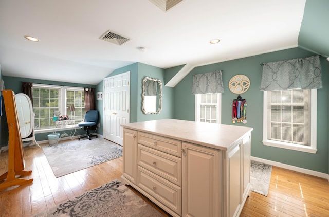 51 Wood Lot Ln, Southbury, CT 06488 - kitchen with lofted ceiling, light wood-style floors, a desk, light countertops, and a kitchen island