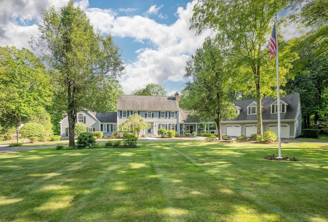 51 Wood Lot Ln, Southbury, CT 06488 - rear view of house with a lawn and a chimney