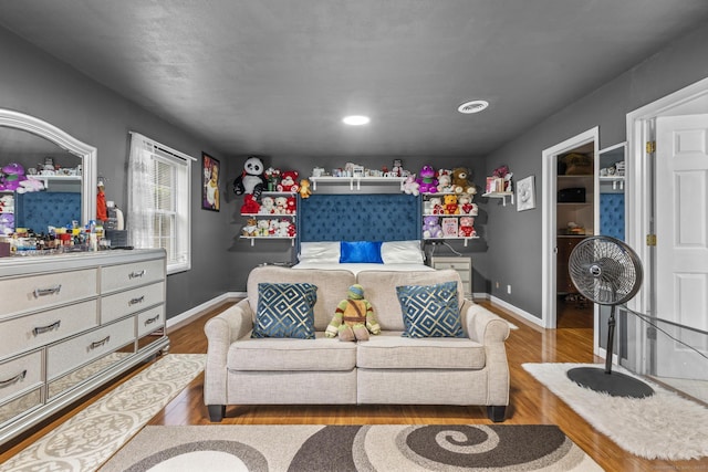 146 Whitewood Rd, Torrington, CT 06790 - living room featuring wood finished floors and baseboards
