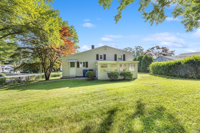 146 Williamson Cir, Watertown, CT 06779 - rear view of house featuring a yard