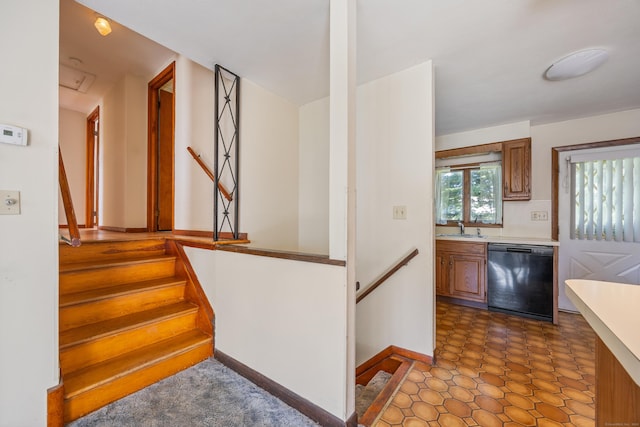 146 Williamson Cir, Watertown, CT 06779 - kitchen featuring dishwasher, brown cabinetry, and light countertops