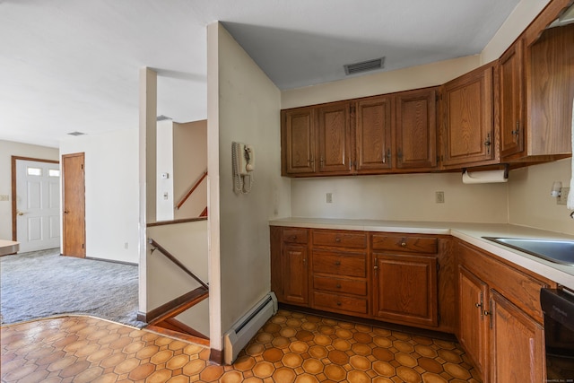 146 Williamson Cir, Watertown, CT 06779 - kitchen with a baseboard radiator, black dishwasher, light countertops, and brown cabinetry