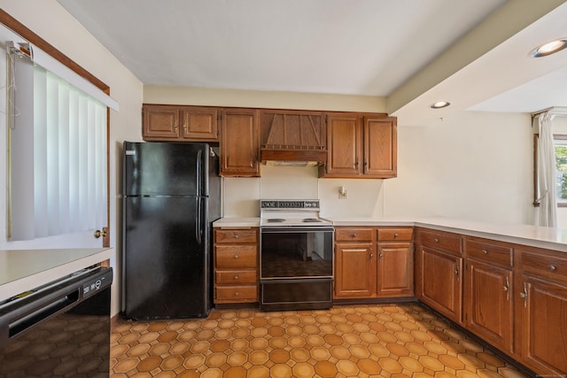 146 Williamson Cir, Watertown, CT 06779 - kitchen with black appliances, custom range hood, light countertops, brown cabinetry, and recessed lighting