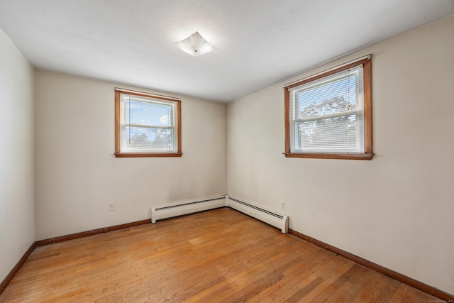 146 Williamson Cir, Watertown, CT 06779 - empty room with healthy amount of natural light, light wood-style flooring, and a baseboard radiator