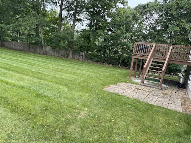 352 Knob Hill Dr, Hamden, CT 06518 - fenced yard with stairs, a wooden deck, a patio, and view of wooded area